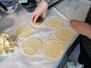 cutting second layer of puff pastry circles